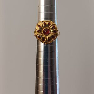 Gold tone Metropolitan Musuem of Art Design ring with red glass accents